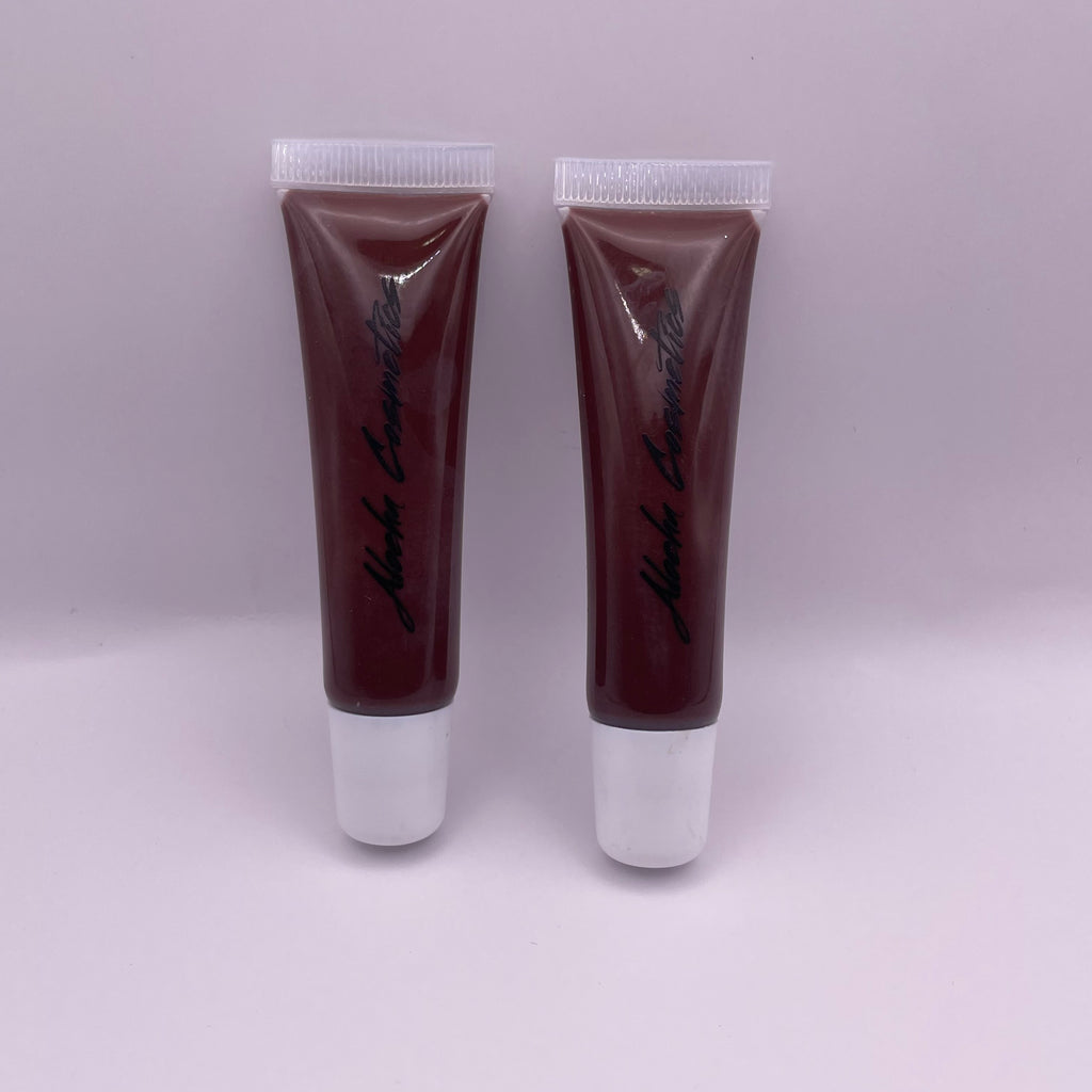 Mocha Magic Lip Gloss in a sleek, black and gold packaging