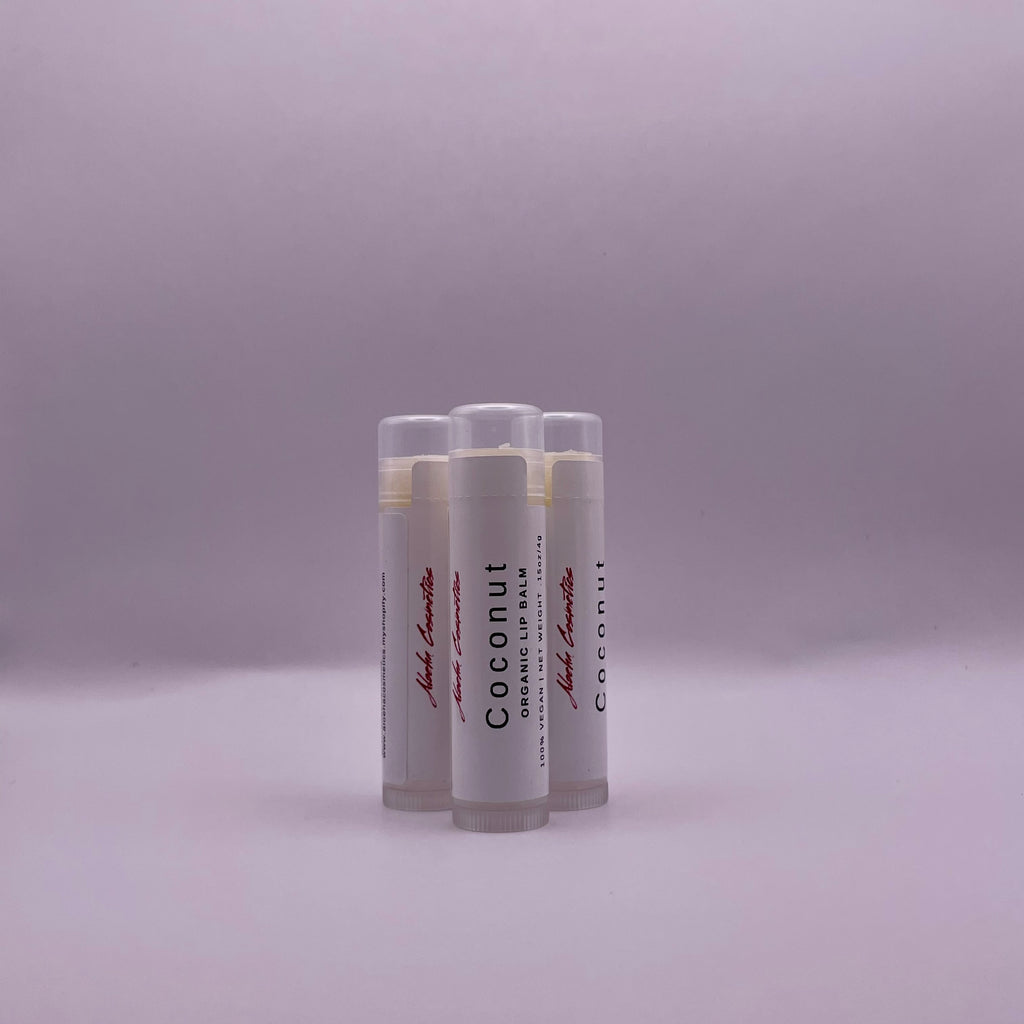 A close-up photo of a coconut lip balm product, featuring natural ingredients for moisturizing and nourishing lips