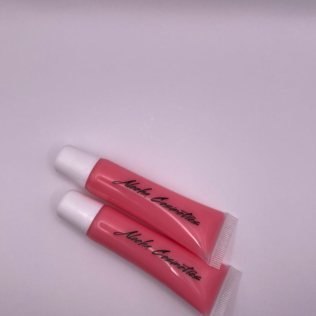 Berrylicious Blush Lip Gloss in a sleek, shiny tube with vibrant berry color